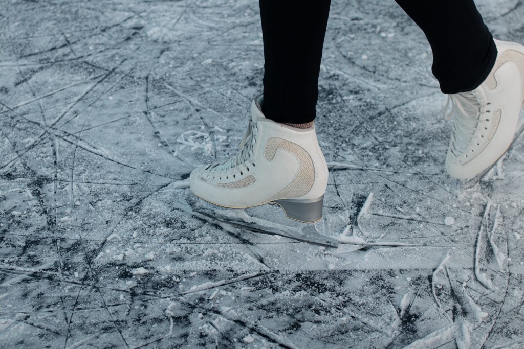 Credit: Karl Hornfeldt. Female ice skates on a frozen natural sheet of ice.